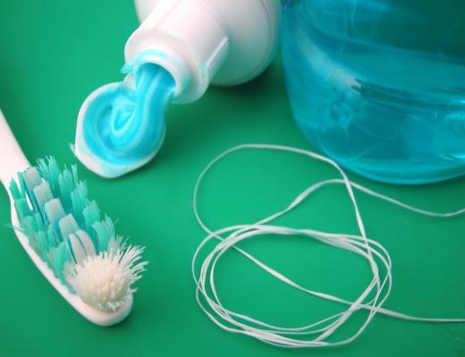 Dental implants require the same regular brushing and flossing as natural teeth in order to prevent discoloration.