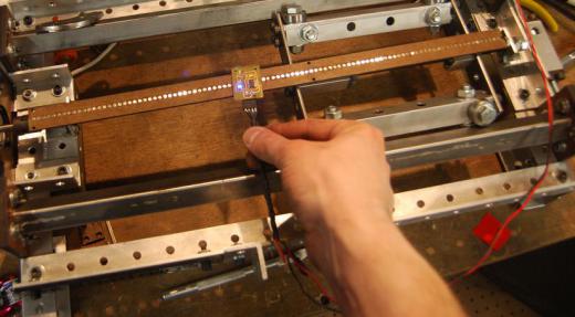 A linear stage uses optical encoders to measure and control position along each axis.