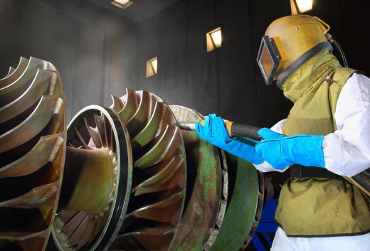 The axis of a turbine is lined with rotating blades that either compress fluids or are turned by them.