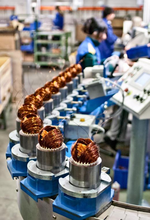 A mechanical assembly line keeps a product moving at a particular pace.