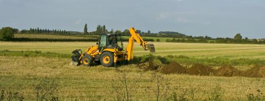 Backhoes may be used for digging drainage ditches.