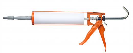 A caulk gun, is used to apply rubber sealant.