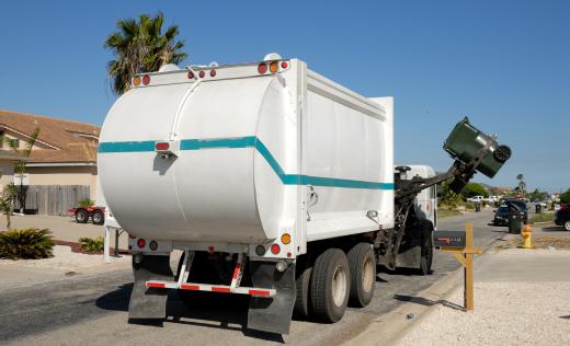 The truck beds of modern garbage trucks feature compactor bins.