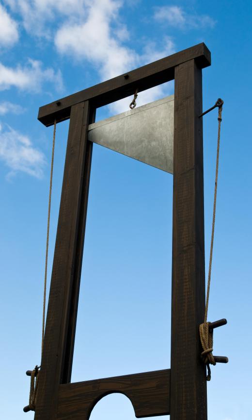 A guillotine, the origin of the name for the guillotine shear.