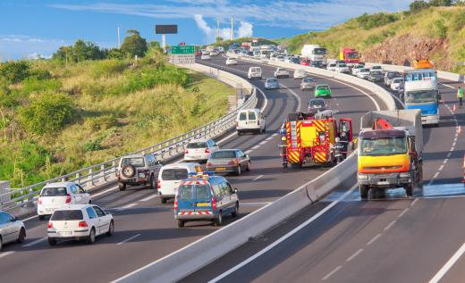 Highway departments use orange traffic cones to divert vehicles around a construction zone.