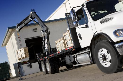 Similar to a mobile crane, a loader crane is used to load materials onto and off of a truck bed.