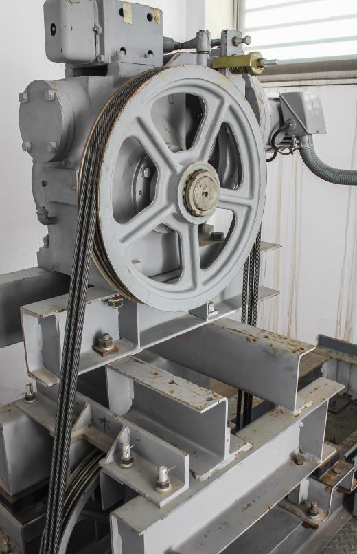 Driven pulleys are set up to move from a turning, motor-driven belt.