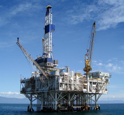 An offshore oil platform. The drilling riser allows for drilling to take place underwater.