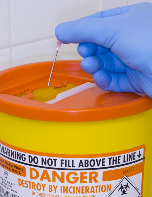 Sharp medical waste is kept in puncture-proof containers before being incinerated.