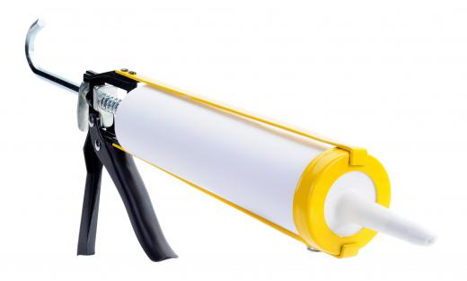 Silicone sealant in a caulk gun, which can be used to seal seams between sheets of corrugated iron.