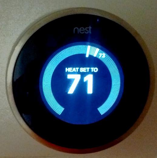 A thermostat receiving temperature data from a wireless sensor.