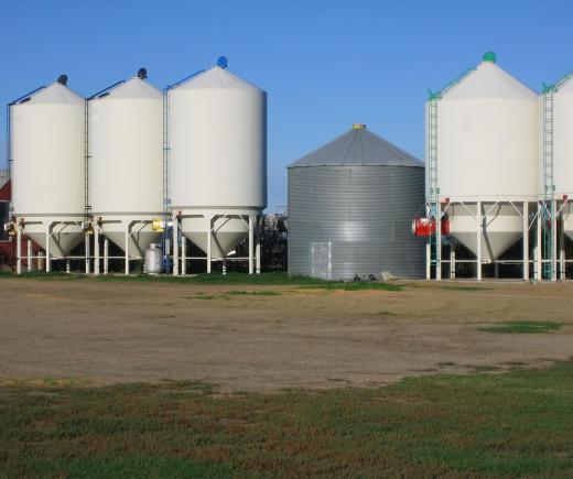 Load-formation material handling equipment includes bulk handling containers like grain silos.