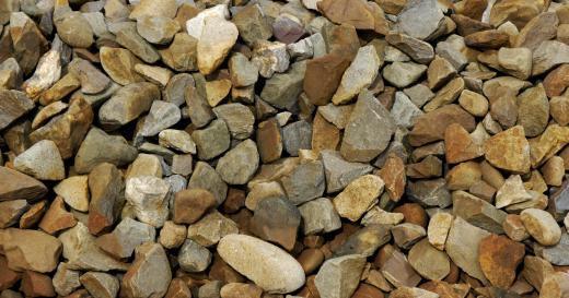 Crushed aggregate is produced in quarries by processing larger rocks into smaller pieces.