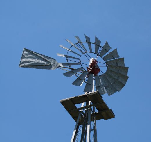 Windmills use blades turned by wind to pump water from the ground.